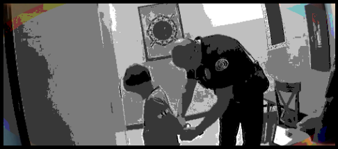 image of police officer escorting parole-eligible juvenile offender in handcuffs